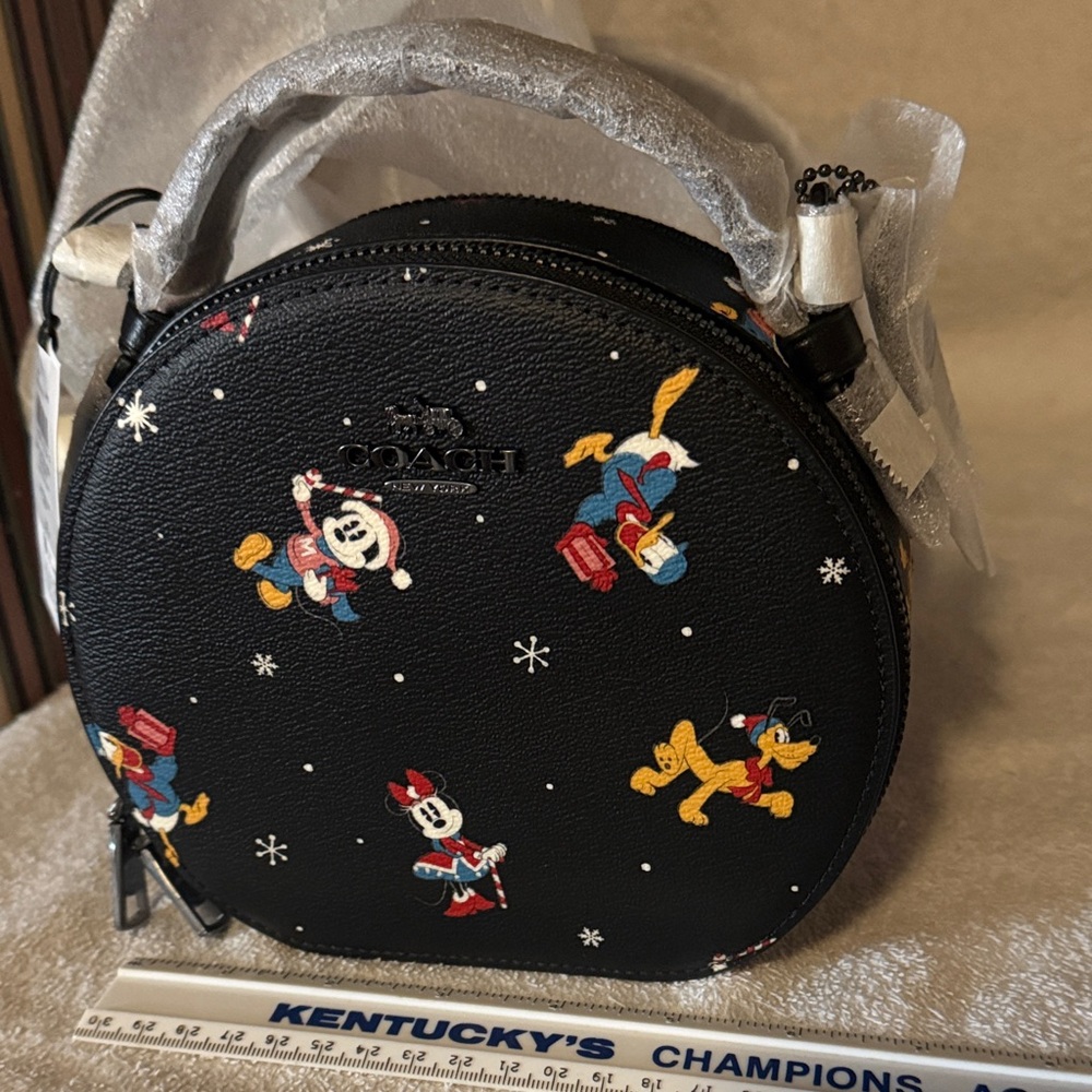 Coach Black Round canteen Crossbody with Disney holiday print